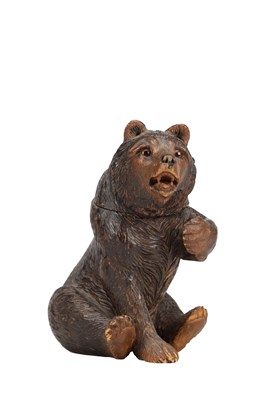 Lot 812 - A 19TH CENTURY BLACK FOREST CARVED LINDENWOOD BEAR INKWELL
