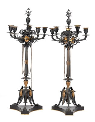 Lot 945 - A PAIR OF 19TH CENTURY PATINATED AND GILT BRONZE REGENCY STYLE CANDELABRA