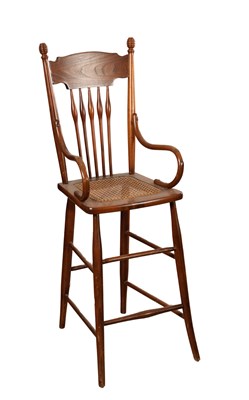 Lot 1516 - AN EARLY 20TH CENTURY AMERICAN CHILD'S HIGH CHAIR WITH CANE SEAT