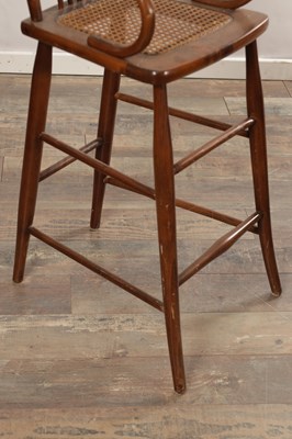 Lot 1516 - AN EARLY 20TH CENTURY AMERICAN CHILD'S HIGH CHAIR WITH CANE SEAT