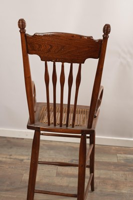 Lot 1516 - AN EARLY 20TH CENTURY AMERICAN CHILD'S HIGH CHAIR WITH CANE SEAT