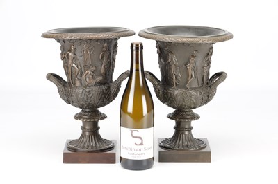 Lot A PAIR OF 19TH CENTURY PATINATED BRONZE CAMPANA URNS WITH CLASSICAL FIGURE RELIEF ON SQUARE PLINTH BASES