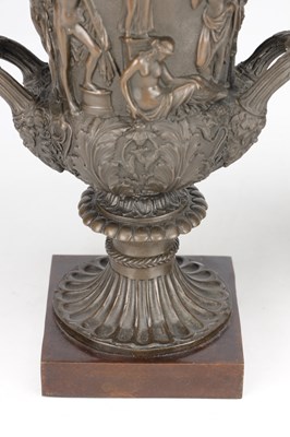 Lot A PAIR OF 19TH CENTURY PATINATED BRONZE CAMPANA URNS WITH CLASSICAL FIGURE RELIEF ON SQUARE PLINTH BASES