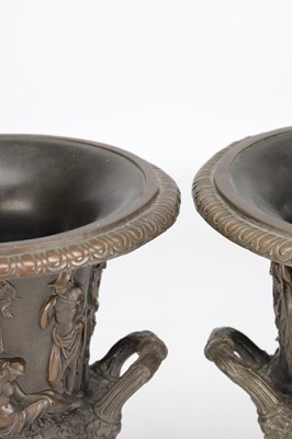 Lot A PAIR OF 19TH CENTURY PATINATED BRONZE CAMPANA URNS WITH CLASSICAL FIGURE RELIEF ON SQUARE PLINTH BASES