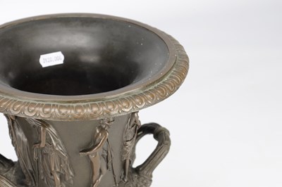 Lot A PAIR OF 19TH CENTURY PATINATED BRONZE CAMPANA URNS WITH CLASSICAL FIGURE RELIEF ON SQUARE PLINTH BASES