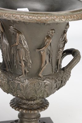 Lot A PAIR OF 19TH CENTURY PATINATED BRONZE CAMPANA URNS WITH CLASSICAL FIGURE RELIEF ON SQUARE PLINTH BASES