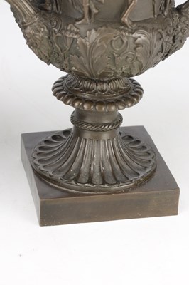 Lot A PAIR OF 19TH CENTURY PATINATED BRONZE CAMPANA URNS WITH CLASSICAL FIGURE RELIEF ON SQUARE PLINTH BASES
