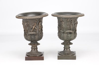 Lot A PAIR OF 19TH CENTURY PATINATED BRONZE CAMPANA URNS WITH CLASSICAL FIGURE RELIEF ON SQUARE PLINTH BASES
