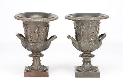 Lot A PAIR OF 19TH CENTURY PATINATED BRONZE CAMPANA URNS WITH CLASSICAL FIGURE RELIEF ON SQUARE PLINTH BASES