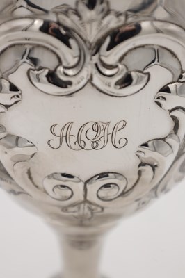 Lot 100 - A SILVER TROPHY CUP WITH REPOUSSE DECORATION