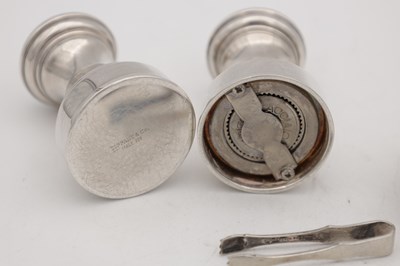 Lot 5 - A TIFFANY & CO PEPPER MILL AND SALT WITH A SILVER LIDDED SWEETENER AND TONGS
