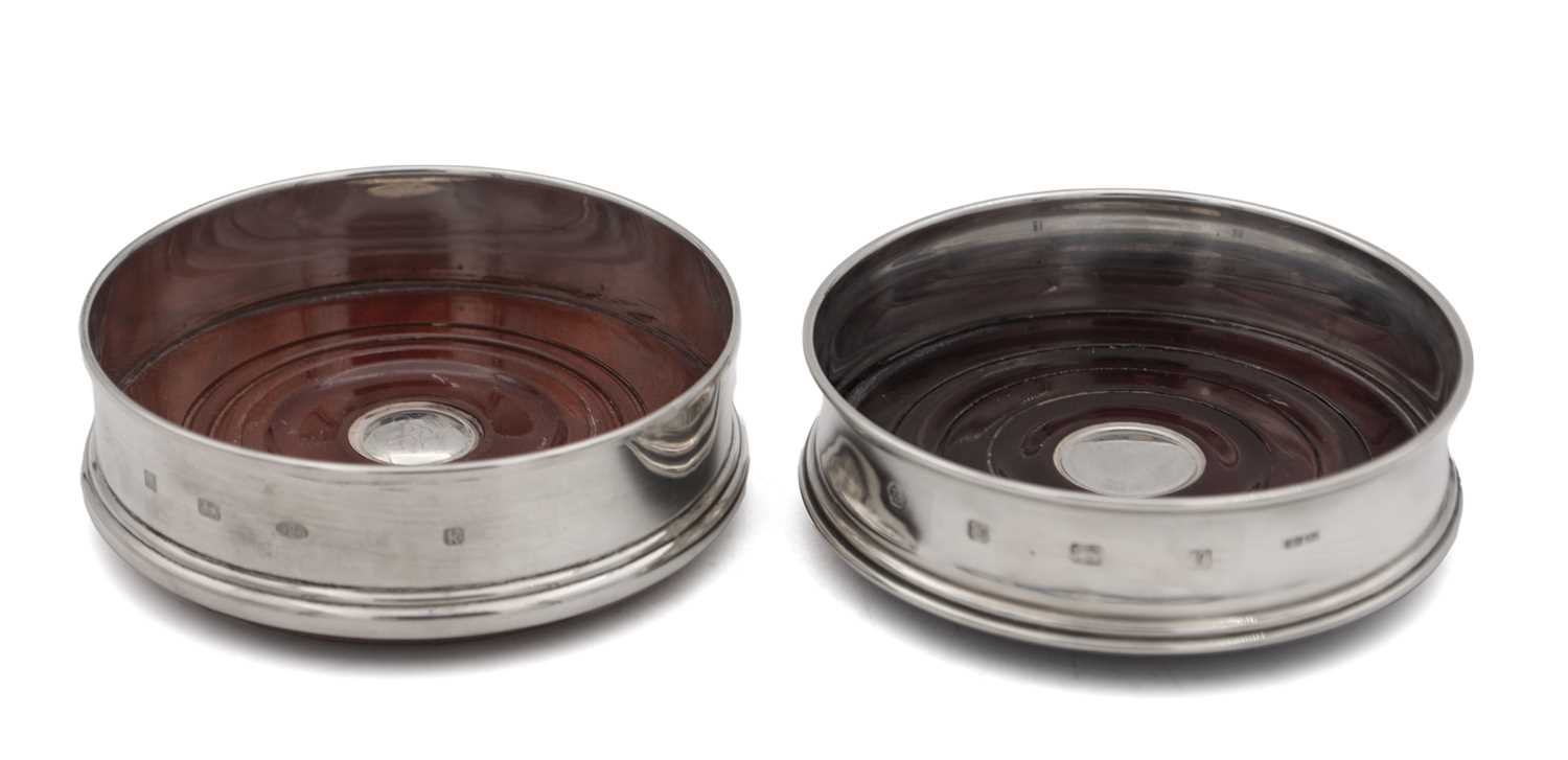 Lot 12 - TWO ENGLISH SILVER AND WOOD WINE COASTERS