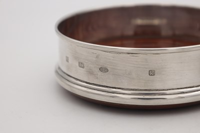 Lot 12 - TWO ENGLISH SILVER AND WOOD WINE COASTERS