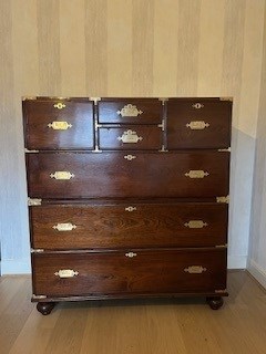 Lot 1533 - AN UNUSUALLY LARGE MID 19TH CENTURY CAMPHORWOOD CAMPAIGN CHEST WITH BRASS RECESSED HANDLES