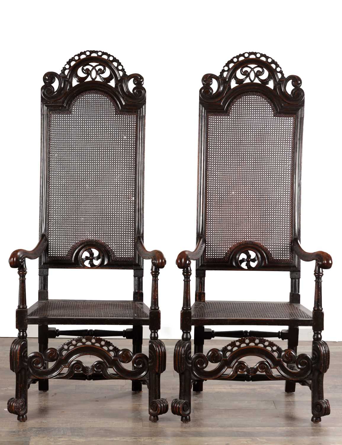 Lot 1583 - A PAIR OF WILLIAM AND MARY WALNUT HIGH-BACK CANED ARMCHAIRS