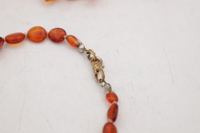 Lot 222 - A COLLECTION OF THREE AMBER NECKLACES