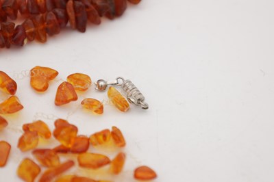 Lot 222 - A COLLECTION OF THREE AMBER NECKLACES