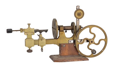 Lot 502 - A BRASS AND STEEL WATCHMAKER'S LATHE ON WOODEN BASE
