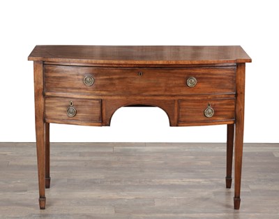 Lot 1696 - A GEORGE III FIGURED MAHOGANY BOW-FRONTED SIDEBOARD OF SMALL SIZE