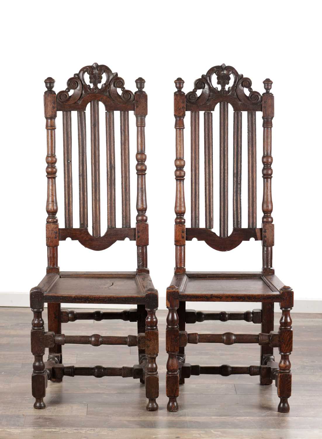 Lot 1558 - A PAIR OF 17TH CENTURY ENGLISH OAK HALL CHAIRS