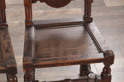 Lot 1558 - A PAIR OF 17TH CENTURY ENGLISH OAK HALL CHAIRS