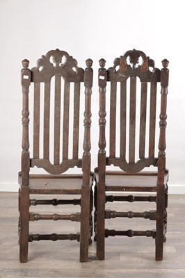 Lot 1558 - A PAIR OF 17TH CENTURY ENGLISH OAK HALL CHAIRS