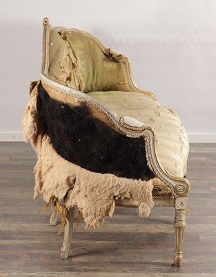 Lot 1584 - A GEORGE III PARCEL GILT AND PAINTED HEPPLEWHITE STYLE THREE SEATER SETTEE