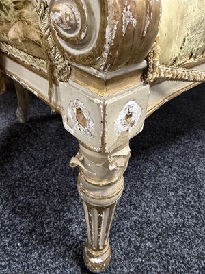 Lot 1584 - A GEORGE III PARCEL GILT AND PAINTED HEPPLEWHITE STYLE THREE SEATER SETTEE