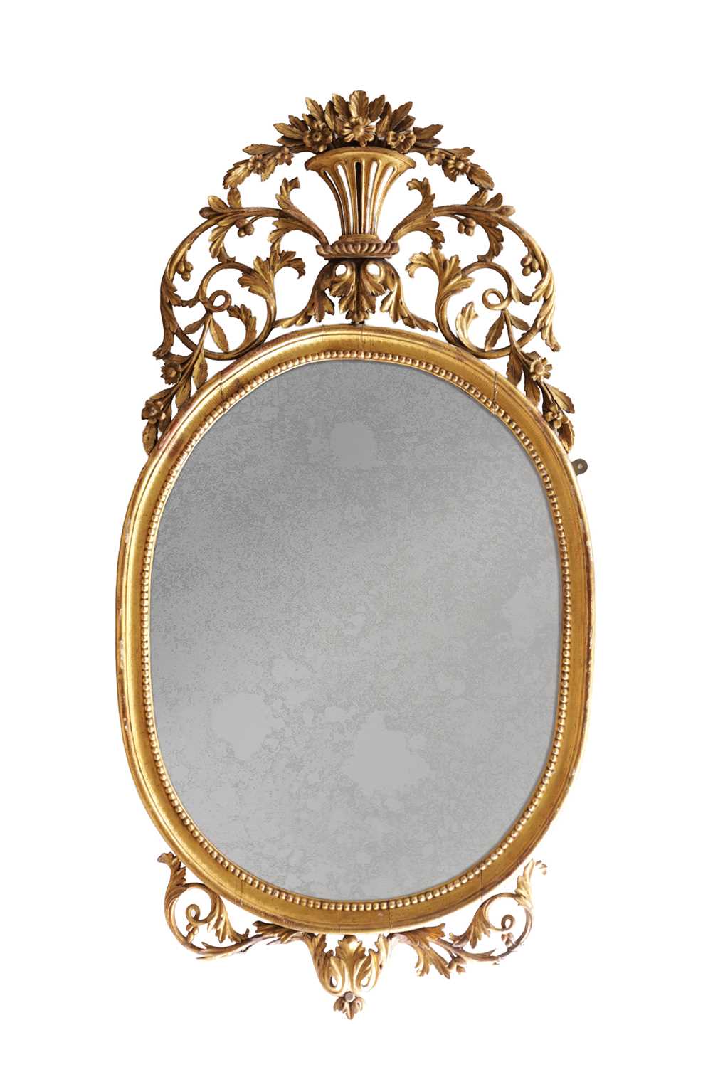 Lot 1588 - A GEORGE III CARVED GILTWOOD OVAL HANGING MIRROR WITH FLOWER BASKET CRESTING