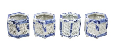 Lot 750 - A SET OF FOUR JAPANESE BLUE AND WHITE PORCELAIN HEXAGONAL CRICKET CAGES