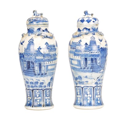 Lot 825 - A PAIR OF CHINESE BLUE AND WHITE PORCELAIN VASES AND COVERS