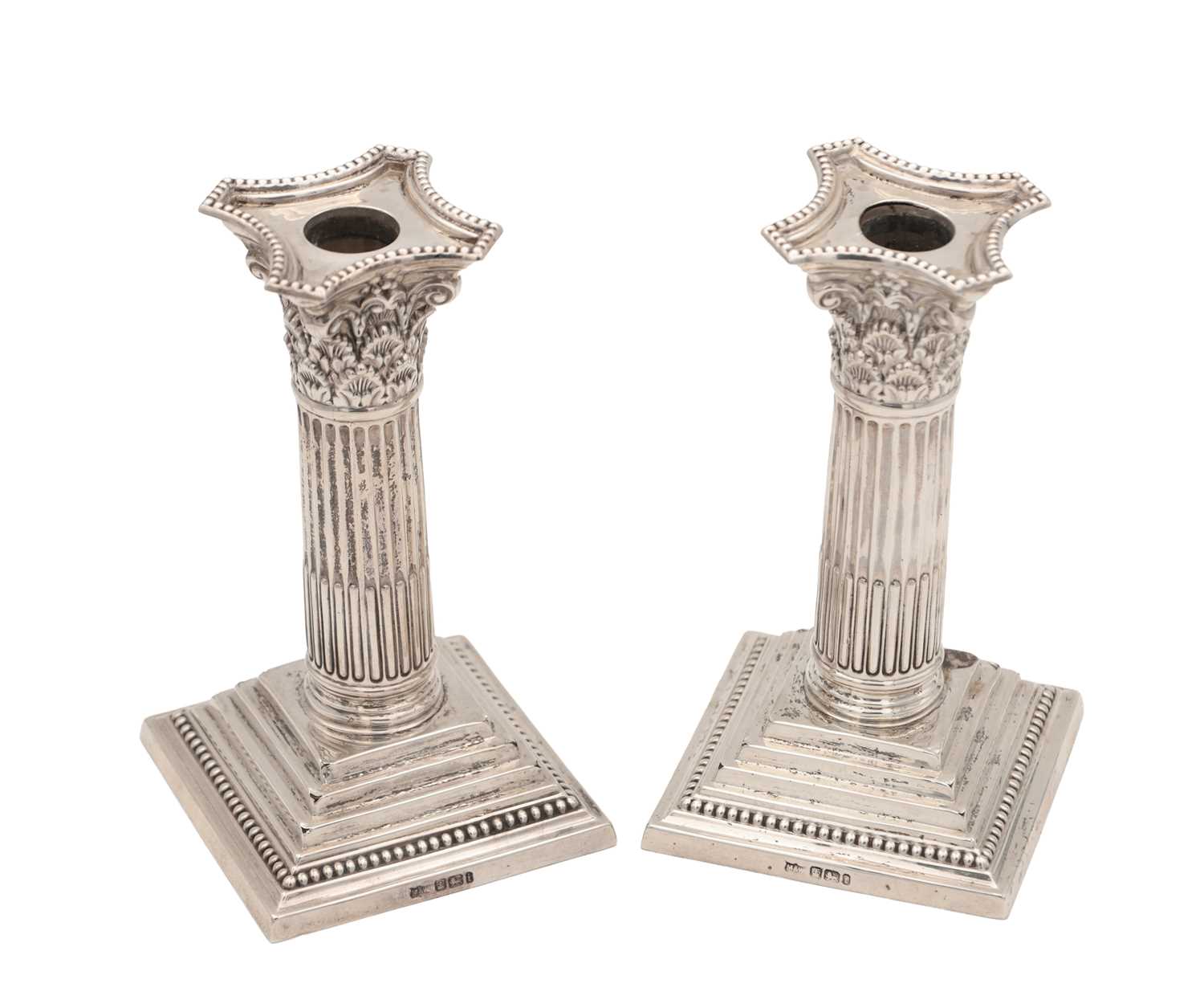 Lot 97 - A PAIR OF LATE VICTORIAN ENGLISH SILVER CANDLESTICKS