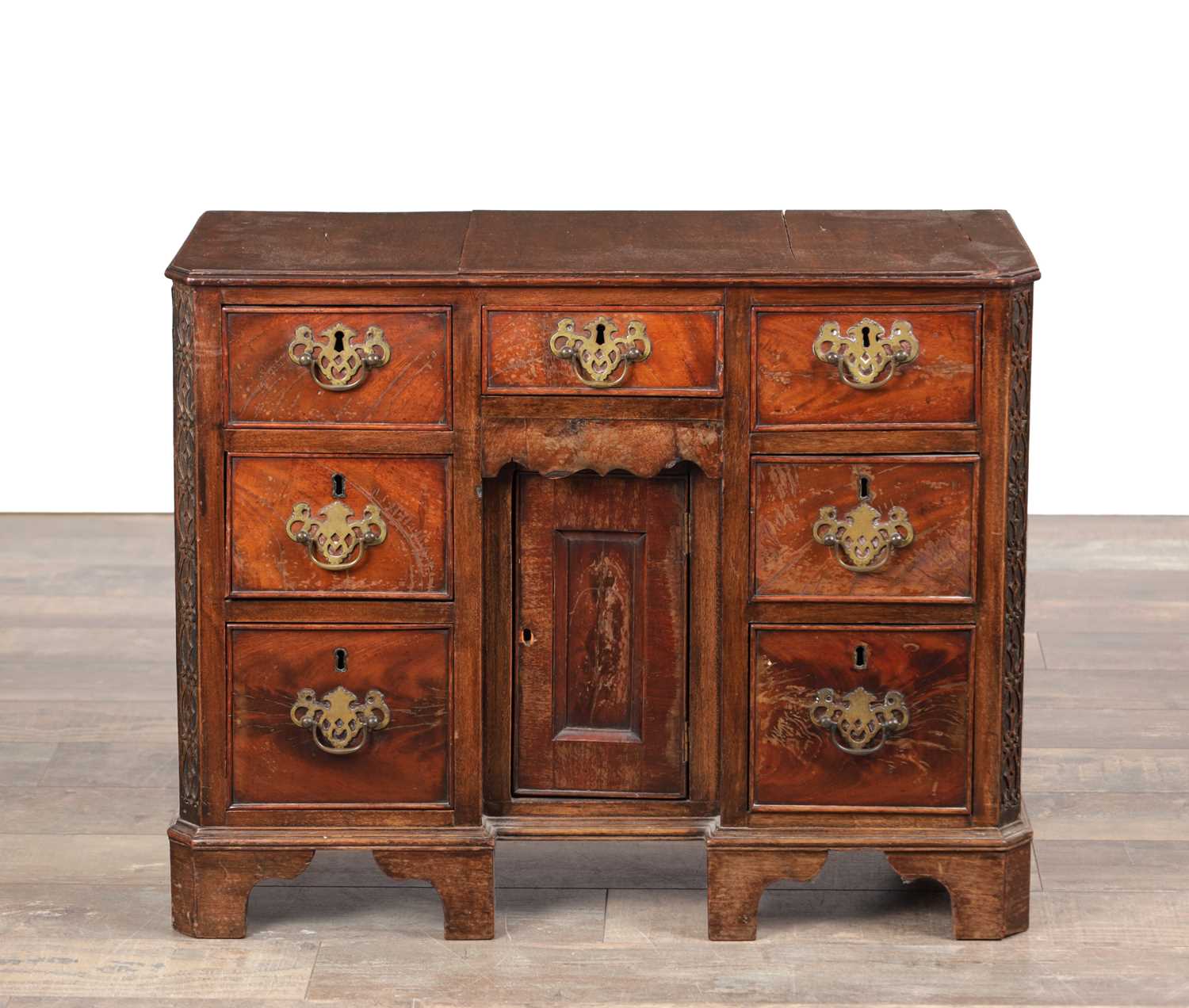 Lot 1556 - A MINIATURE GEORGE III MAHOGANY KNEEHOLE DESK
