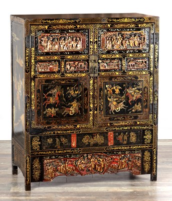 Lot 1487 - A LATE 19TH CENTURY CHINESE INLAID BLACK LACQUER CABINET WITH RELIEF CARVED GILT PANELS