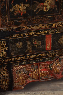 Lot 1487 - A LATE 19TH CENTURY CHINESE INLAID BLACK LACQUER CABINET WITH RELIEF CARVED GILT PANELS