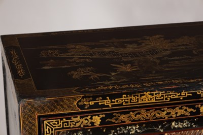 Lot 1487 - A LATE 19TH CENTURY CHINESE INLAID BLACK LACQUER CABINET WITH RELIEF CARVED GILT PANELS