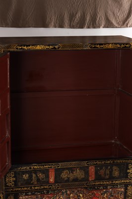 Lot 1487 - A LATE 19TH CENTURY CHINESE INLAID BLACK LACQUER CABINET WITH RELIEF CARVED GILT PANELS