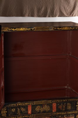 Lot 1487 - A LATE 19TH CENTURY CHINESE INLAID BLACK LACQUER CABINET WITH RELIEF CARVED GILT PANELS