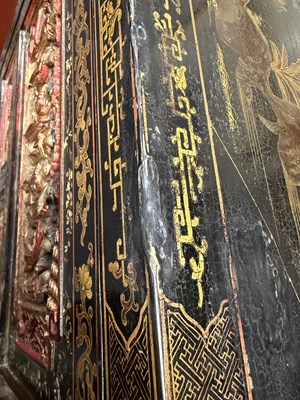 Lot 1487 - A LATE 19TH CENTURY CHINESE INLAID BLACK LACQUER CABINET WITH RELIEF CARVED GILT PANELS
