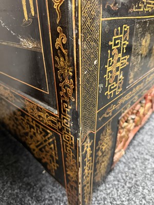 Lot 1487 - A LATE 19TH CENTURY CHINESE INLAID BLACK LACQUER CABINET WITH RELIEF CARVED GILT PANELS