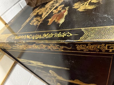 Lot 1487 - A LATE 19TH CENTURY CHINESE INLAID BLACK LACQUER CABINET WITH RELIEF CARVED GILT PANELS