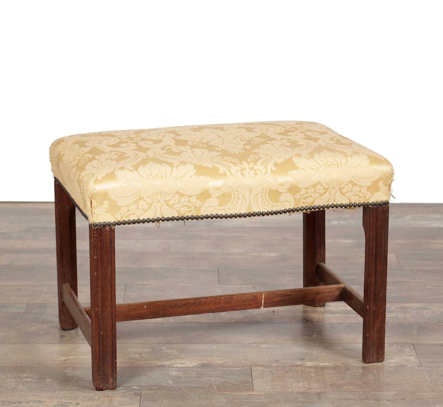 Lot 1579 - A GEORGE III MAHOGANY UPHOLSTERED DRESSING STOOL