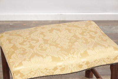 Lot 1579 - A GEORGE III MAHOGANY UPHOLSTERED DRESSING STOOL