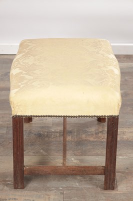 Lot 1579 - A GEORGE III MAHOGANY UPHOLSTERED DRESSING STOOL