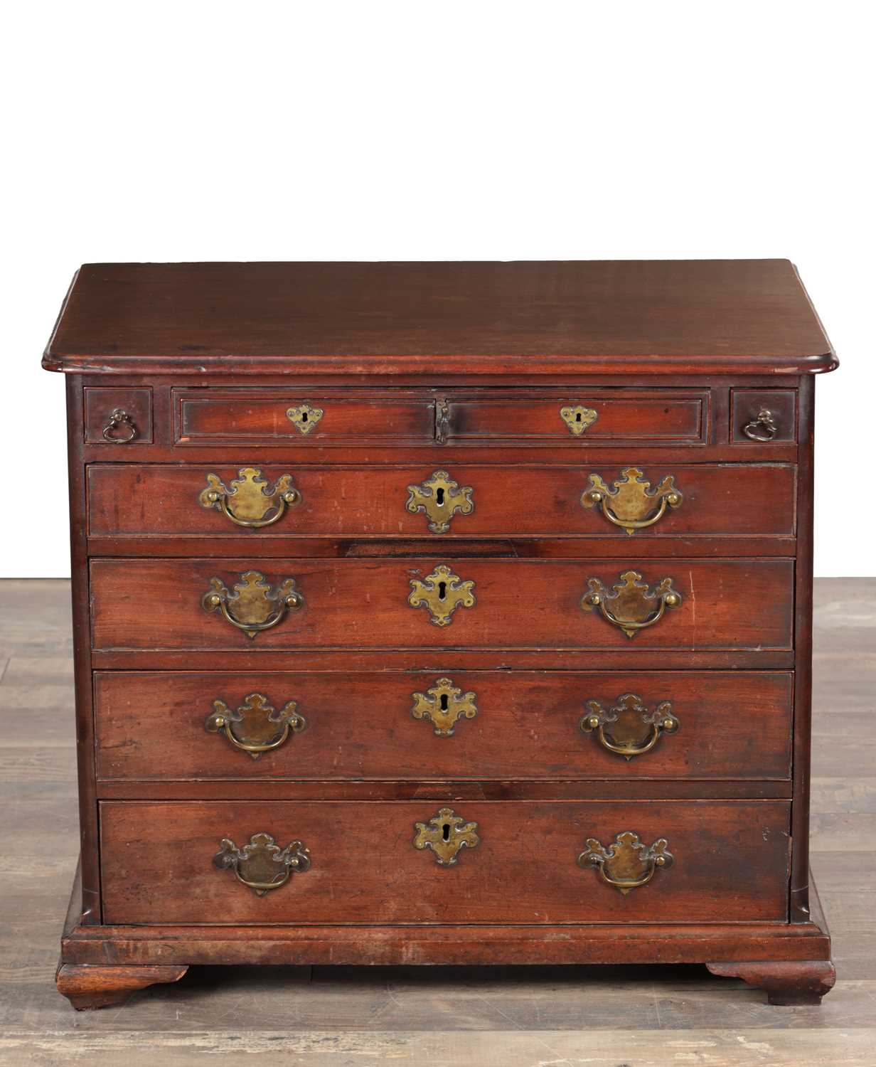 Lot 1509 - AN UNUSUAL GEORGE II MAHOGANY SMALL CHEST OF DRAWERS