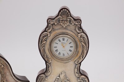 Lot 102 - TWO ENGLISH SILVER MOUNTED MINIATURE MANTEL CLOCKS