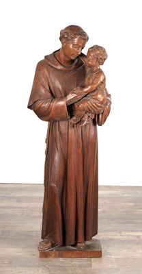 Lot 1396 - A 17TH CENTURY STYLE CARVED PINE FIGURE OF ST ANTHONY WITH THE CHRIST CHILD