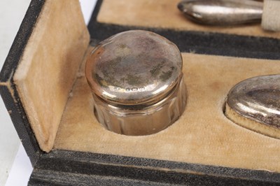 Lot 47 - A COLLECTION OF LATE 19TH TO EARLY 20TH CENTURY ENGLISH SILVER-MOUNTED TOILET AND STATIONERY ITEMS