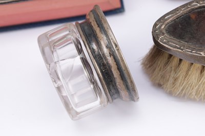 Lot 47 - A COLLECTION OF LATE 19TH TO EARLY 20TH CENTURY ENGLISH SILVER-MOUNTED TOILET AND STATIONERY ITEMS