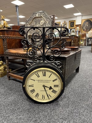 Lot 1323 - A GOOD LATE 19TH CENTURY CAMERER, CUSS & CO LONDON DOUBLE-SIDED FUSEE RAILWAY STATION CLOCK ON SCROLLED CAST IRON BRACKET